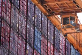Stack of containers under a crane 