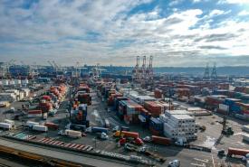 an aerial shot of aport terminal with trucks entering and exiting